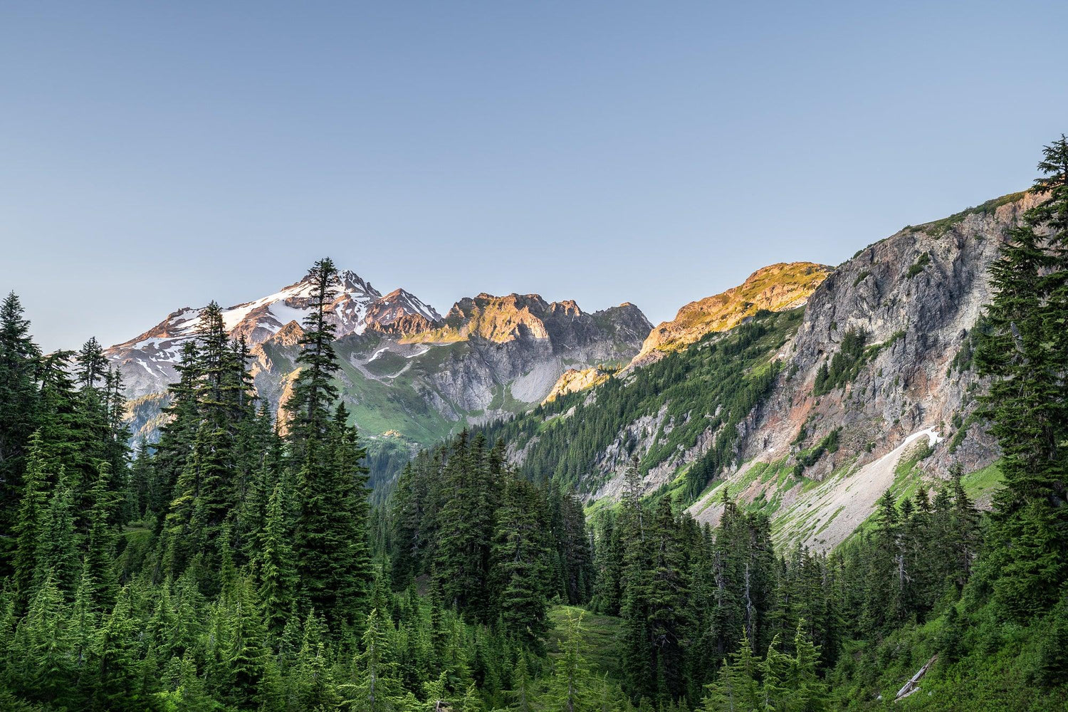 Fine Pacific Crest Trail photography print of the setting sun casting a cool alpine glow on the mountain tops.