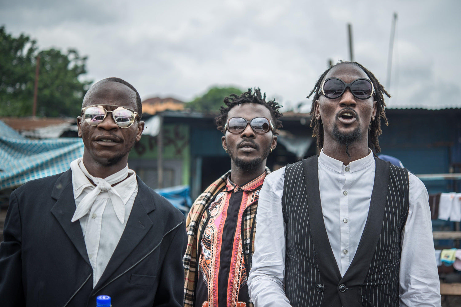 Fine sapeur photography print of three fashionable Sapeur men dressed up and strutting their clothes in Kinshasa, Democratic Republic of the Congo.