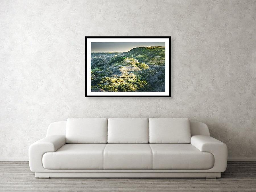 Framed fine photographic and wall art print of a sun-soaked butte in Theodore Roosevelt National Park in North Dakota.
