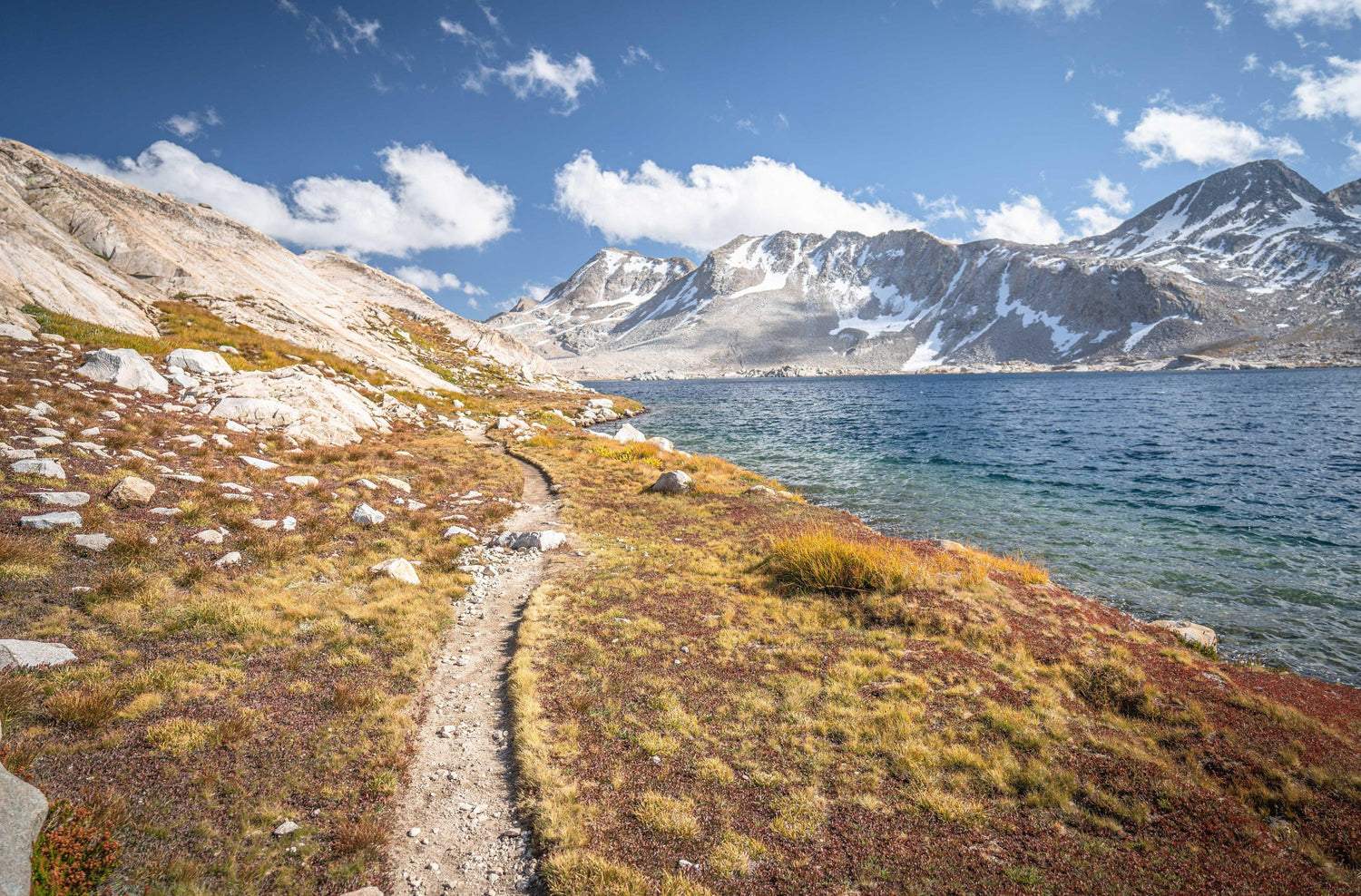 Fine photographic print of the Pacific Crest Trail meandering along a cold alpine lake in the High Sierra Mountain Range.