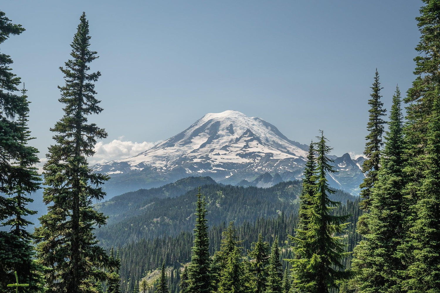 Fine Pacific Crest Trail photography print of a view of Mount Rainier as the trail passes close by the base of the snowy mountain.