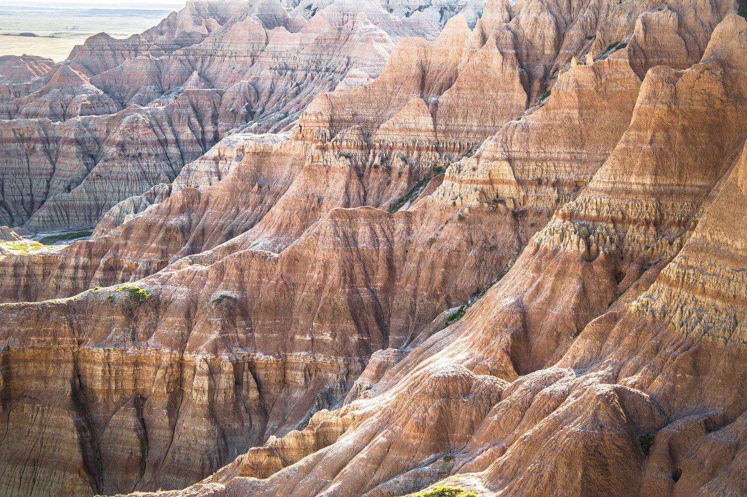 Fine photographic print of the painted ripples of the Badlands National Park landscape in South Dakota.
