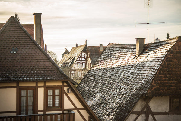 Fine photographic and art print of the morning sunlit rooftops of the Bavarian and historical town of Rothenburg ob der Tauber in Germany.