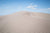 Fine Great Sand Dunes photography print of a waving sand dune with a blue sky backdrop.