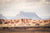 Fine Grand Staircase Escalante National Monument photography print of the massive rock formations dwarfing the expansive mountains in the foreground.