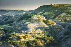 Fine photographic and art print of a sun-soaked butte in Theodore Roosevelt National Park in North Dakota.
