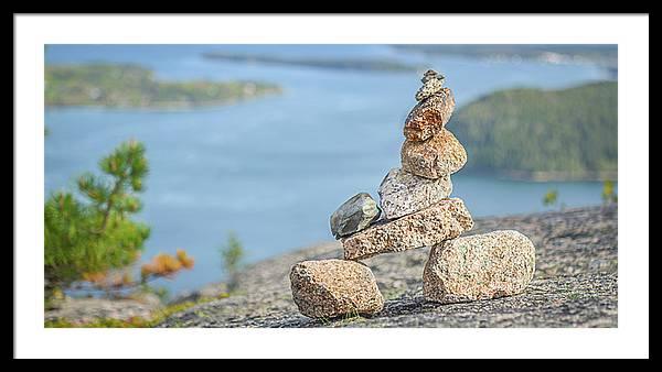 Framed fine photographic print of a rock cairn in the foreground of the waterways of Acadia National Park in Maine.