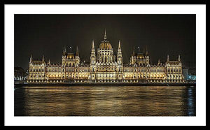 Framed fine photographic and art print of the Hungarian Parliament building in Budapest at nighttime with the light reflecting on the Danube River.