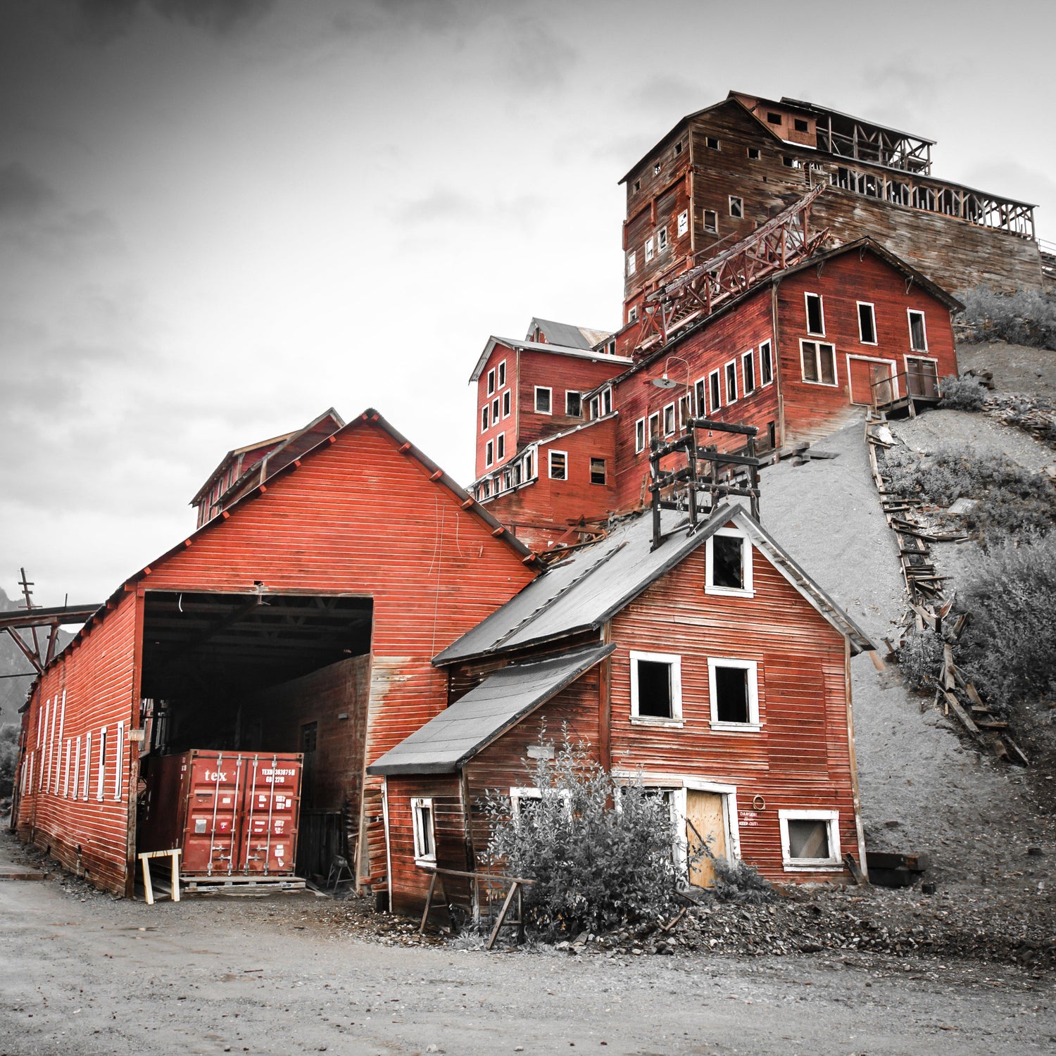 Fine photographic and art print of the towering red buildings of the Kennecott Mine in Wrangell St Elias National Park in Alaska.