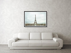 Framed fine photographic and wall art print of the Eiffel Tower in the distance with a cloudy backdrop over the landscape of Paris France. 