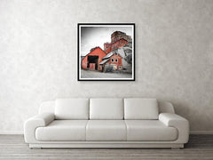 Framed fine photographic and wall art print of the towering red buildings of the Kennecott Mine in Wrangell St Elias National Park in Alaska.