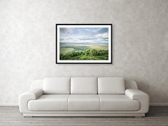 Framed fine Ngorongoro Crater photography and wall art print of the expansive crater atop the rim as the clouds breach the crater, casting shadows on the luscious landscape.