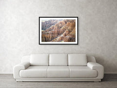Framed fine photographic and wall art print of the painted ripples of the Badlands National Park landscape in South Dakota.