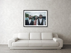 Framed fine sapeur photography and wall art print of three fashionable Sapeur men dressed up and strutting their clothes in Kinshasa, Democratic Republic of the Congo.