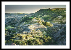 Framed fine photographic and art print of a sun-soaked butte in Theodore Roosevelt National Park in North Dakota.